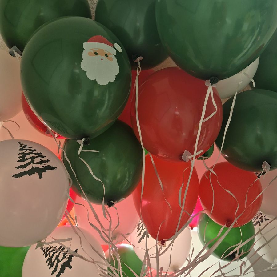 Christmas-themed balloons prepared for a choir performance